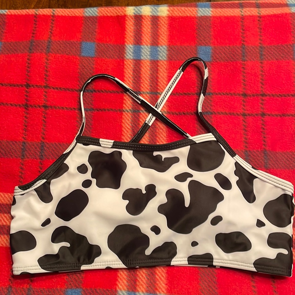 This is a new black and white Cow print shein two piece swimsuit.